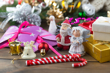 Merry Christmas and Happy New Year, postcard with gifts and Christmas decorations.