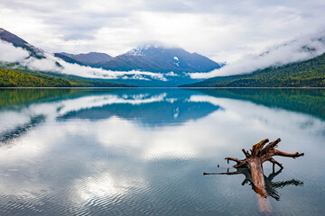 Alaska northern lake with snow mountains in the back