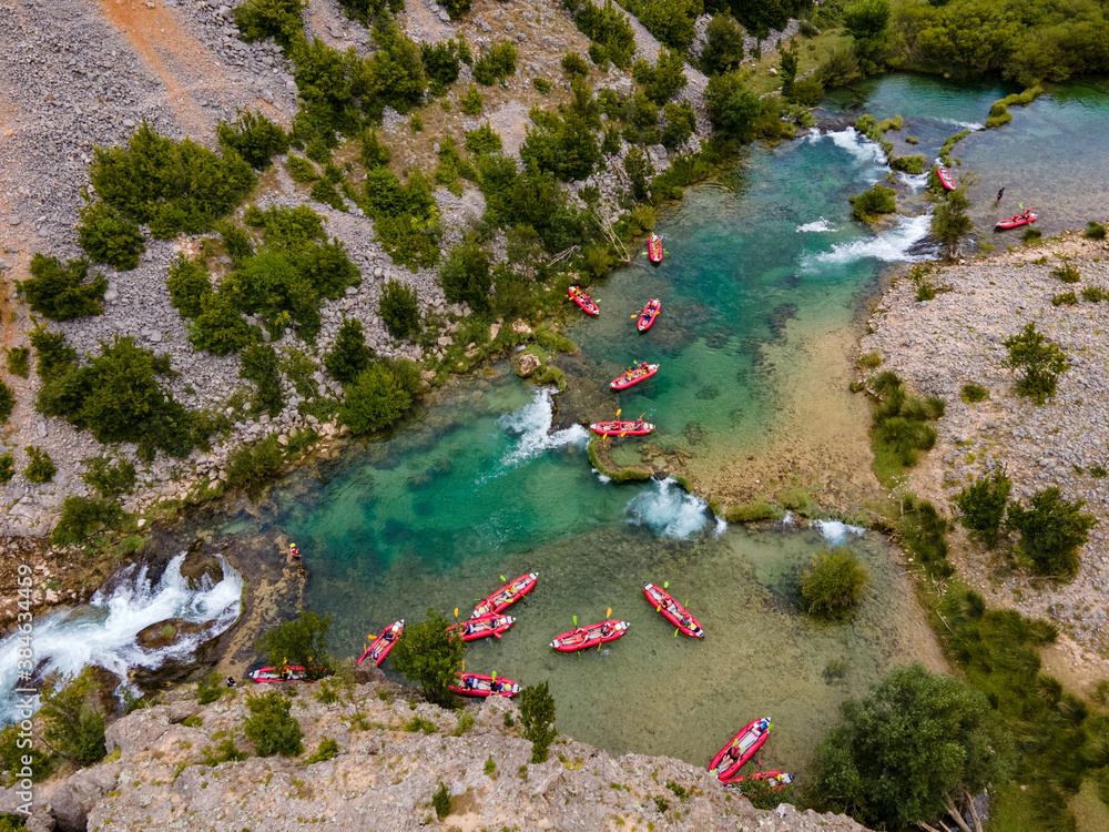 Sticker Zrmanja River in northern Dalmatia, Croatia is famous for its crystal clear waters and countless waterfalls surrounded by a deep canyon.