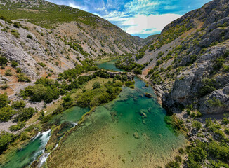 Fototapeta na wymiar Zrmanja River in northern Dalmatia, Croatia is famous for its crystal clear waters and countless waterfalls surrounded by a deep canyon.