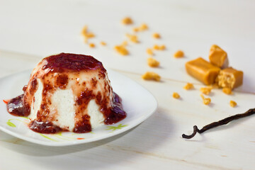 Delicious vanilla panna cotta with a berry jam