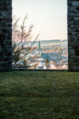 View on the city below through portal in the ruins