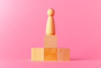 Toy wooden cubes with copy space against pink background