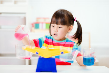 young girl play balance toy for homeschooling