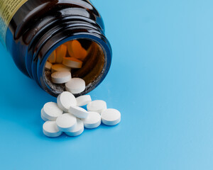 zinc tablets, nutrition supplement pills on blue background