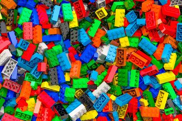 Fototapeta na wymiar Background from colored plastic building blocks, 3D rendering