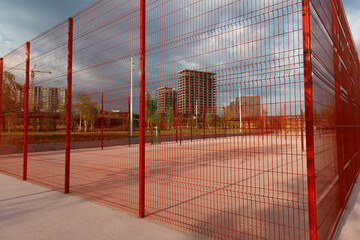 Outdoor playground iron mesh fence new district under construction. 