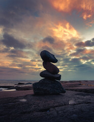 Zen Stacked Stone with Sunset Clouds Background