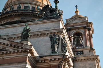 Isaac's Cathedral, Saint Petersburg, Russia, 11.10.2020. Historic building is in style of classicism. Facade, exterior with green sculptures, angels statues, gold dome, bell tower
