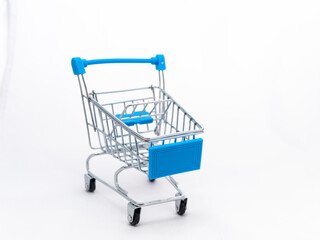 Mini empty grocery cart isolated on white background