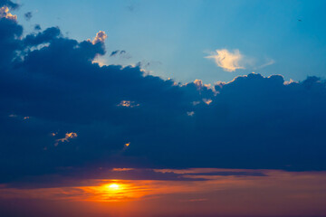Heavy cloudy sky at sunset. A landscape of beautiful nature