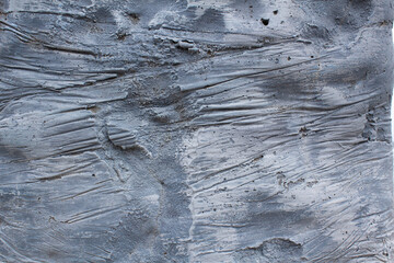 Rough plaster grey stone construction texture wall 
