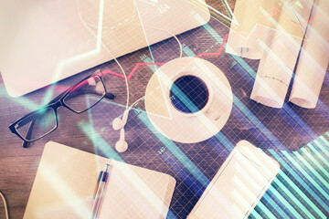 Multi exposure of forex graph drawing over desktop background with computer. Concept of financial analysis. Top view.