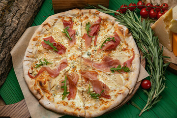 Pizza with cheese and ham in an Italian pizzeria
