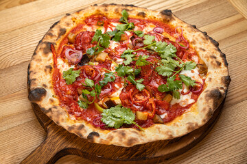 Pizza with cheese and ham in an Italian pizzeria
