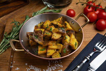 Fried potatoes in a pan in a restaurant
