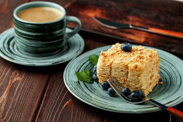 Piece of cake Napoleon on green plate