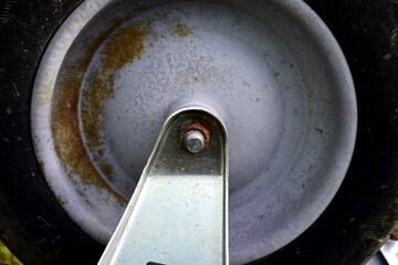 rusty nut on a garden wheelbarrow wheel