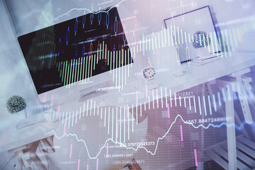 Double exposure of financial graph drawing and office interior background. Concept of stock market.