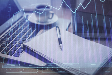 Double exposure of forex chart drawing and desktop with coffee and items on table background. Concept of financial market trading