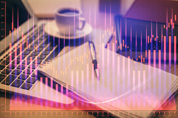 Double exposure of forex chart drawing and desktop with coffee and items on table background. Concept of financial market trading