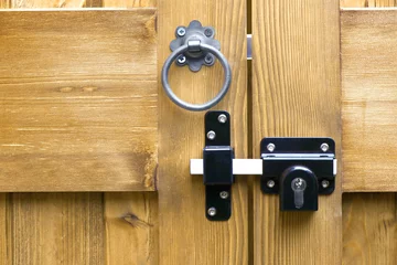Fotobehang Tanalised double wooden gates ring latch handle and locking bolt closeup © Shy Radar
