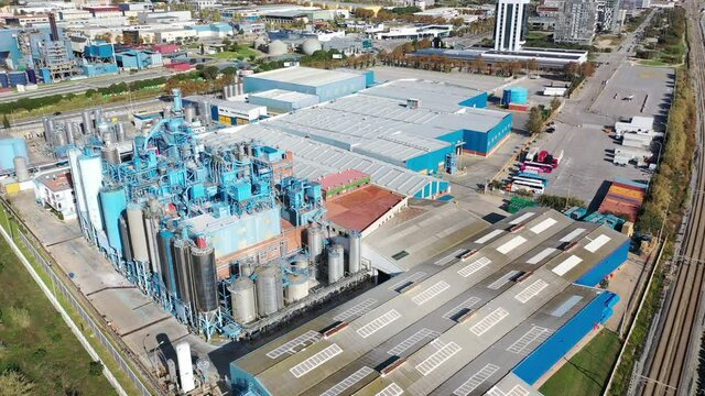 Aerial view of industrial facilities of Mataro factory producing detergent and air fresheners, Costa del Maresme, Spain