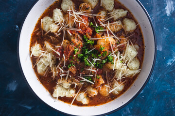 plant-based food, fresh potato gnocchi with tomato sauce and fresh herbs