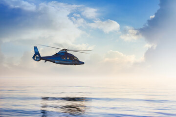 Passanger travel helicopter flying over evening sea with cloudscape.