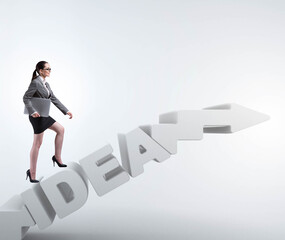 Concept of idea with businesswoman climbing steps stairs