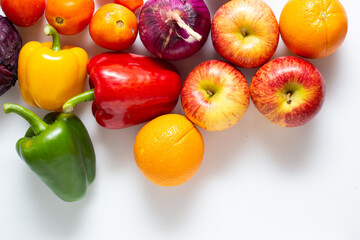 Top view various colorful vegetables and fruits isolated on white background, creative flat layout.