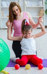 Girl and mother exercising at home