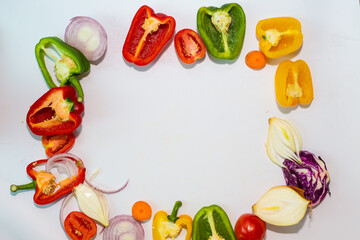 Fresh colorful vegetables in a cut on flat lay white background pattern from vegetables