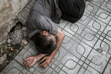 poor people,homeless or beggar begging for help sitting at dirty slum.concept for poverty...