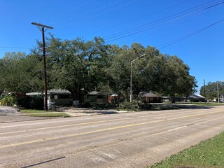 Fototapeta na wymiar Storm damage from Hurricane Delta in Lafayette, Louisiana, causing uprooted trees and down power lines