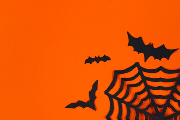 Halloween concept. Festive decorations. Bats on orange background.