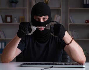 Hacker hacking computer late at night