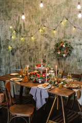 New Year's or Christmas table. The table is covered with food. 2021
