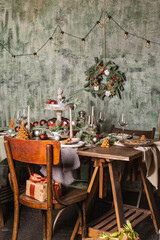 New Year's or Christmas table. The table is covered with food. 2021