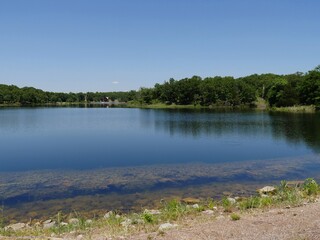 Fototapeta na wymiar Semi side view of a lake at Chickasaw National Recreation Area in Davis, Oklahoma
