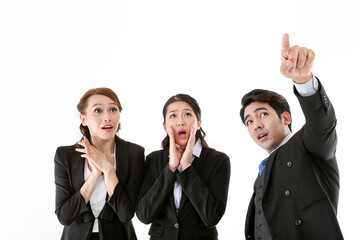 Southeast Asian young office business man woman wearing suit point finger showing up expressions surprise wonder wow on white studio background