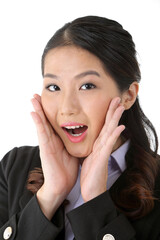 Southeast Asian young office business woman wearing suit hand on cheek surprised expression on white studio background