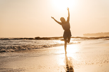 Smile Freedom and happiness chinese woman on beach. She is enjoying serene ocean nature during travel holidays vacation outdoors. asian beauty. summer time