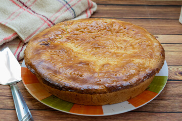 Traditional homemade apple pie with cranberries. complete cake on a wooden table