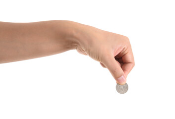 A hand holding a coin in front of a white background