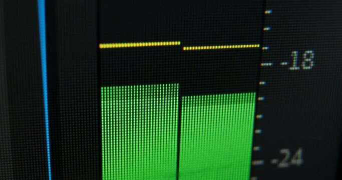 Green digital indicator audio control panels show sound level of left and right channels in normal limits in computer program macro view