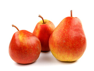 Three ripe pears are isolated on a white background.
