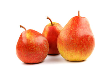 Three ripe pears are isolated on a white background.
