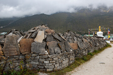 Mani stones in Khumjung village the green village of Sherpa community in Khumbu region of Nepal....
