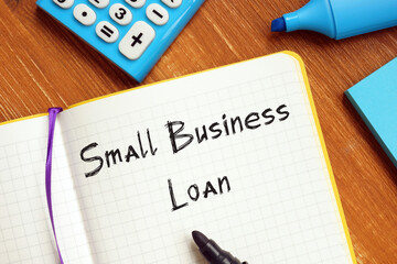 Financial concept meaning Small Business Loan with phrase on the piece of paper.